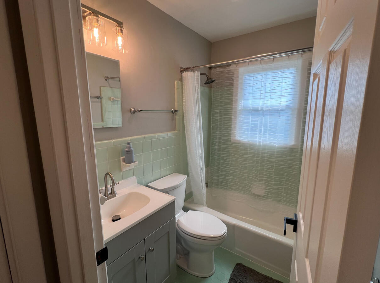 Clean, updated bathroom shared by crew in each apartment.